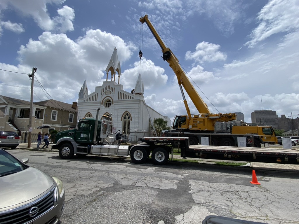 Crews install a new pinnacle June 9. The previous one was damaged during Hurricane Katina in 2005. Photo by Michelle Shoriak