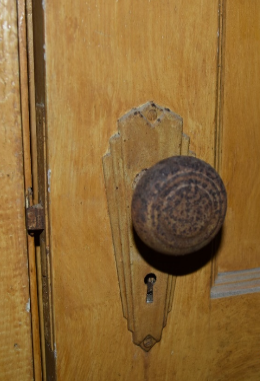 A detail photo of possible original hardware on guest room door