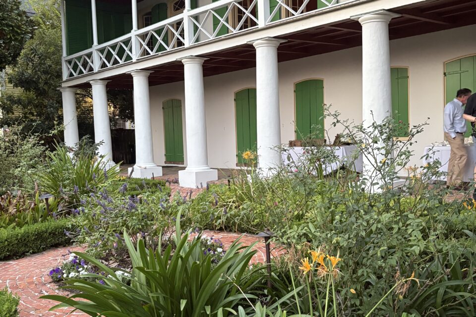The Pitot House, with its green shutters and surrounding botany
