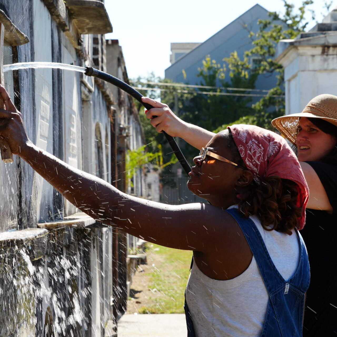 Craftspeople repairing a historic tombstone.