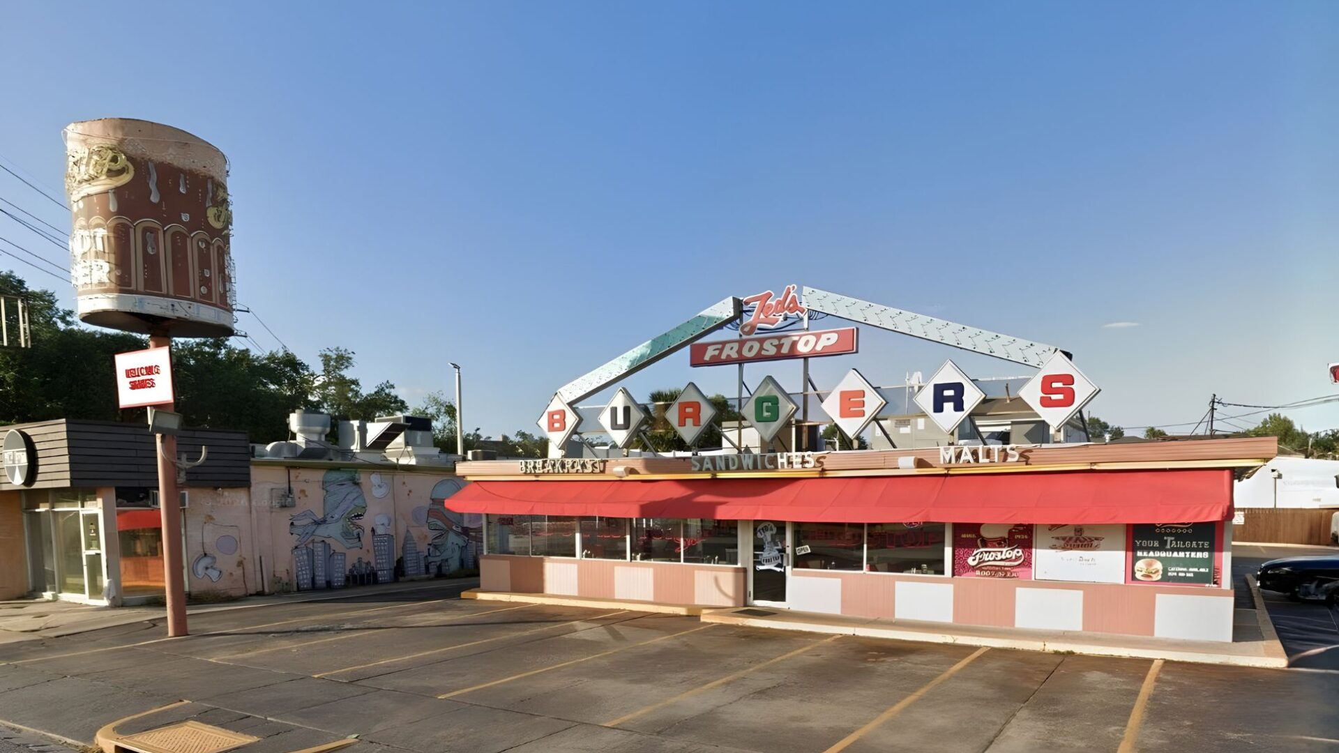 Ted’s Frostop at 3100 Calhoun St., with its iconic 14-foot-tall root beer mug and brightly colored neon signage