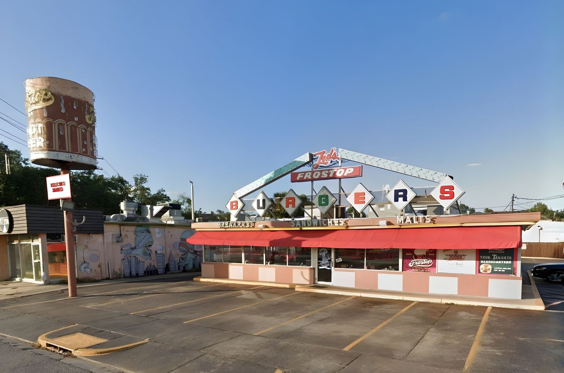 Ted’s Frostop at 3100 Calhoun St., with its iconic 14-foot-tall root beer mug and brightly colored neon signage
