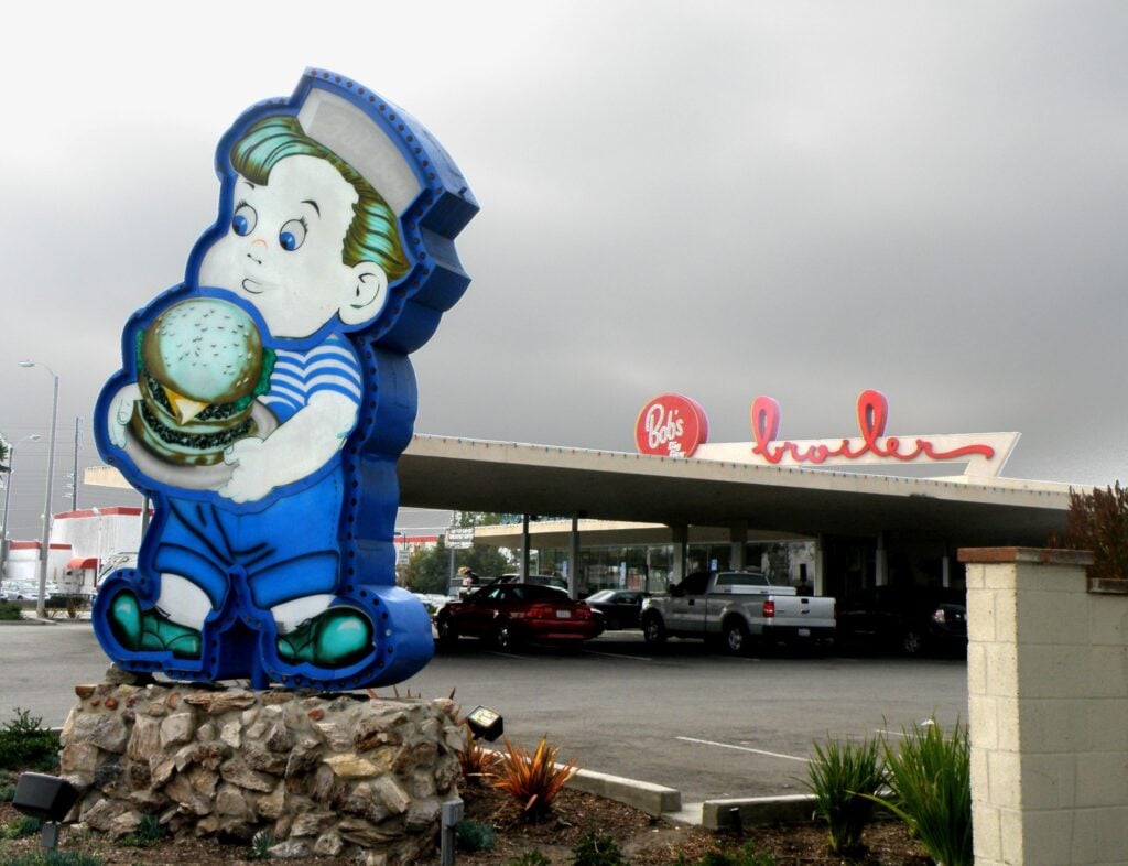 Bob’s Big Boy restaurant in Downey, CA with a large vintage Big Boy statue holding a hamburger outside the building.