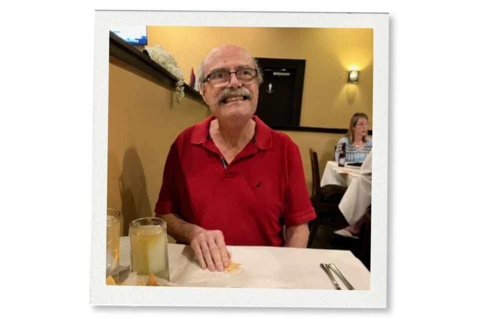 Jonathan Fricker, former director of the Louisiana Division of Historic Preservation, smiling at a restaurant table.