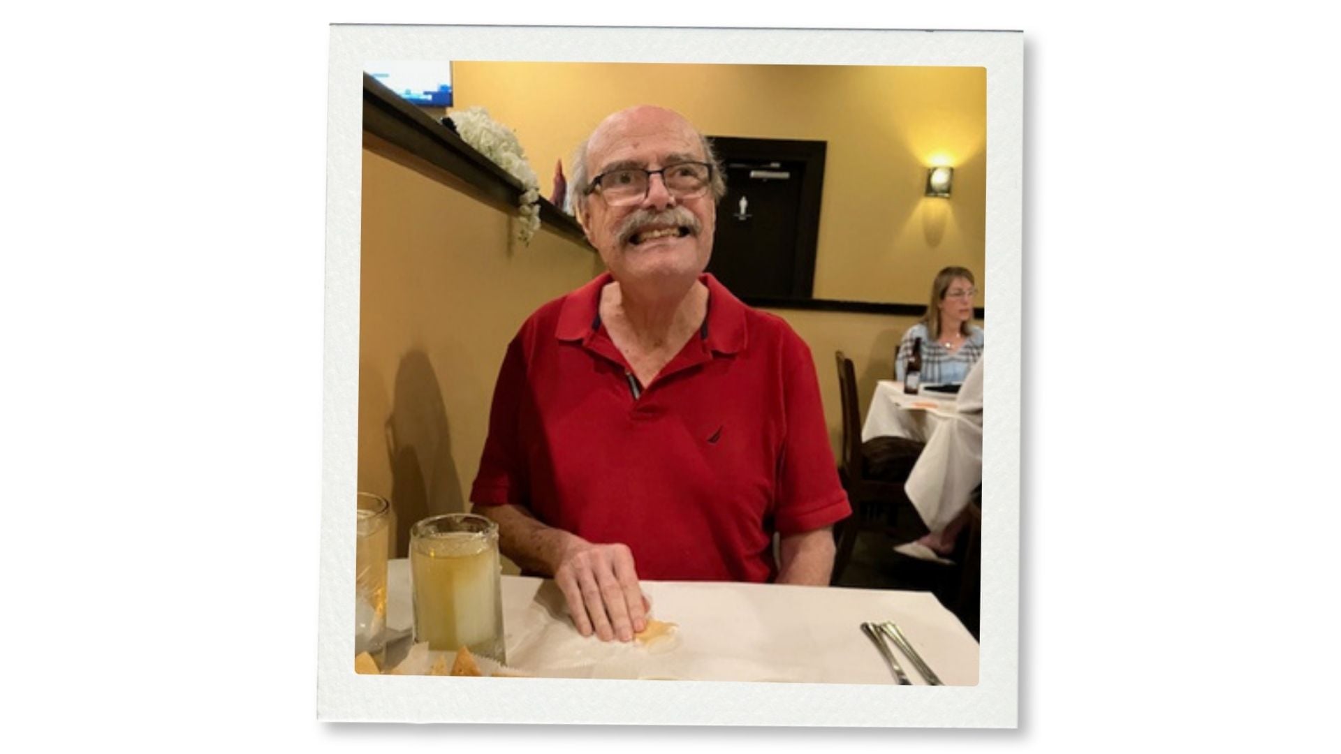 Jonathan Fricker, former director of the Louisiana Division of Historic Preservation, smiling at a restaurant table.