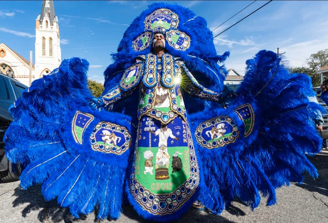 Third Chief Ghost of the Black Hawks Mardi Gras Indians in an elaborate blue feathered suit and headdress at the intersection of 2nd and Dryades streets during Mardi Gras in New Orleans, February 13, 2024.