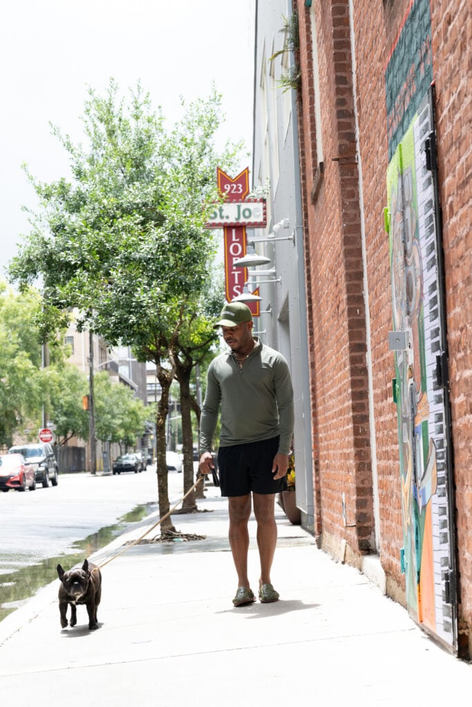Dustin Burks walking his dog outside St. Joe Lofts