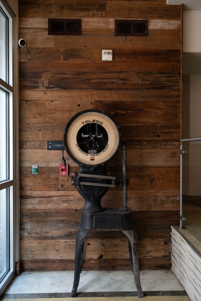Reclaimed wood wall and timber column in the interior of St. Joe Lofts