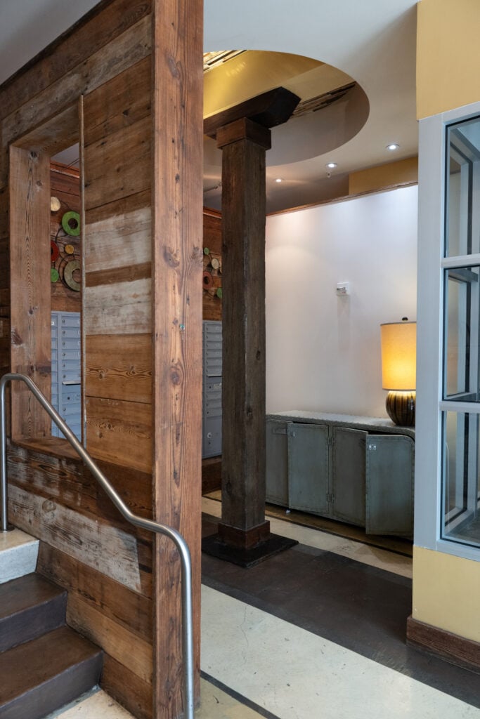 Interior hallway with an antique Toledo industrial scale displayed against a reclaimed wood wall